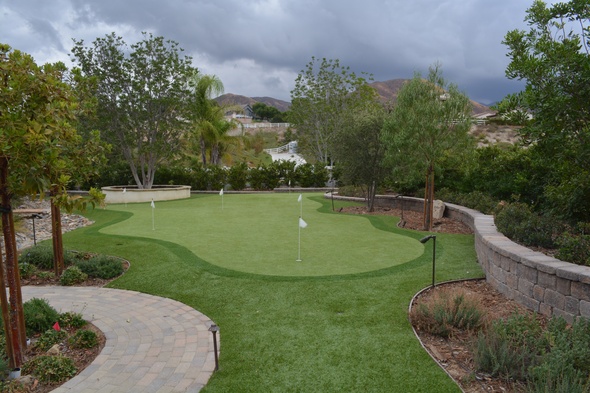 Detroit and all of Michigan Synthetic grass golf green in a landscaped backyard