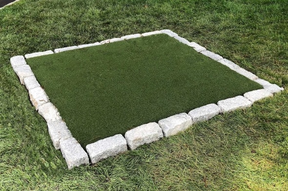 Detroit and all of Michigan Tee box made of synthetic grass surrounded by stone border